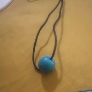 Turquoise Blue Round Bead Pendant on Black String